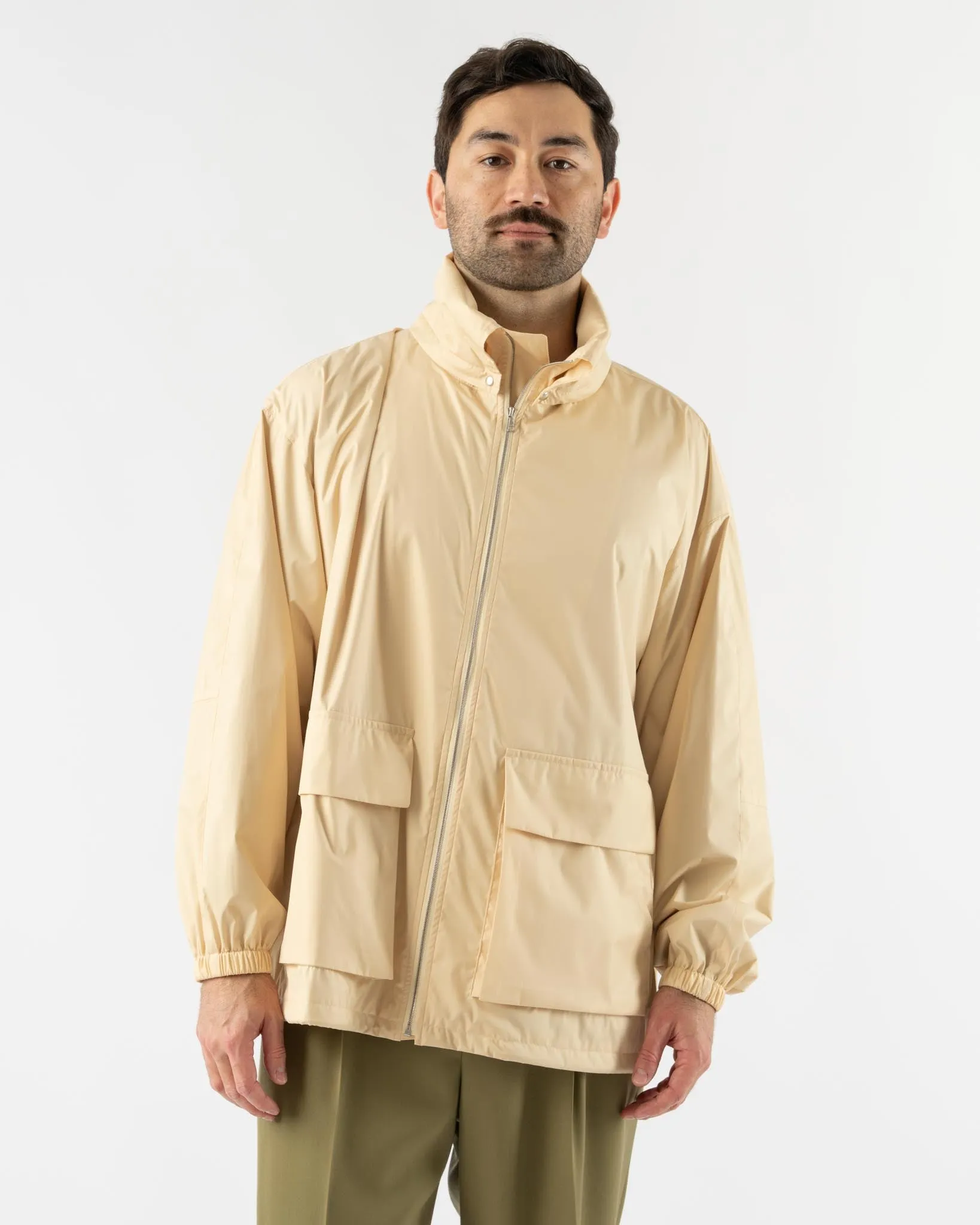 Auralee Hard Twist Polyester Satin Laminate Zip Blouson in Light Beige